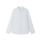 Flat lay of a pale linen blend button-up shirt showing collar, buttons and left chest pocket