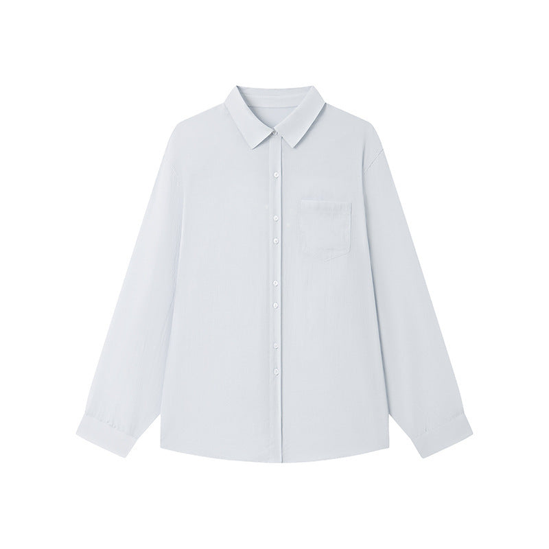 Flat lay of a pale linen blend button-up shirt showing collar, buttons and left chest pocket