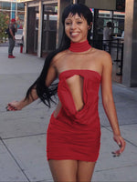 Red backless dress worn for an evening out, open back on show