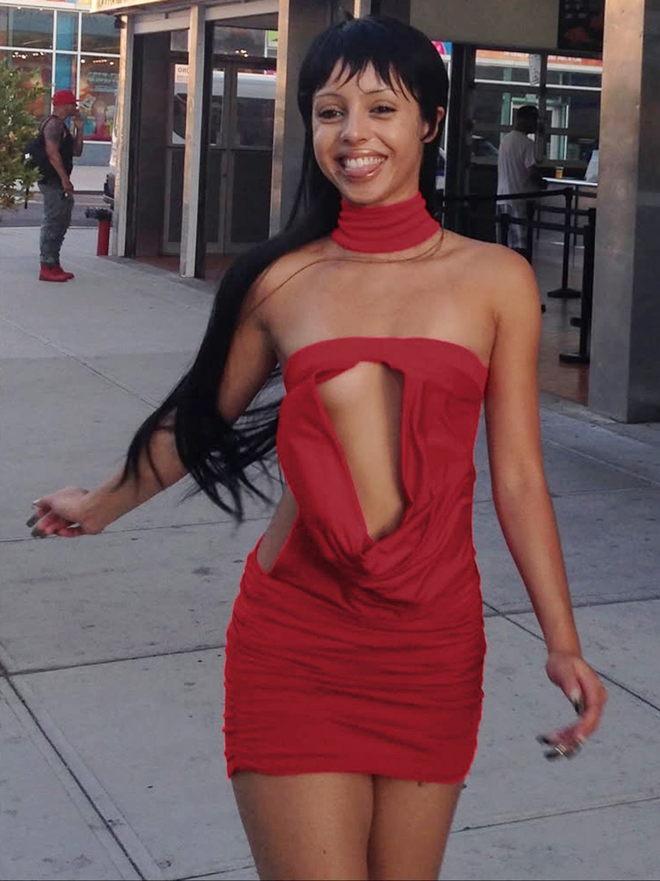 Red backless dress worn for an evening out, open back on show
