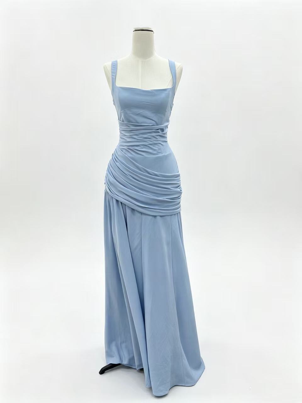 Powder blue square neck maxi dress on a dress form against white, draped hip panel, Blue option