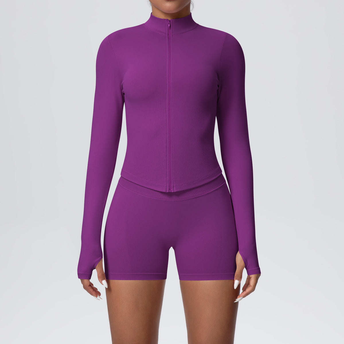 Fitted ribbed seamless zip jacket with a stand collar shown on a female model