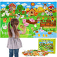 Girl placing felt animals on a farm themed hanging felt story board beside its Little Farm gift box