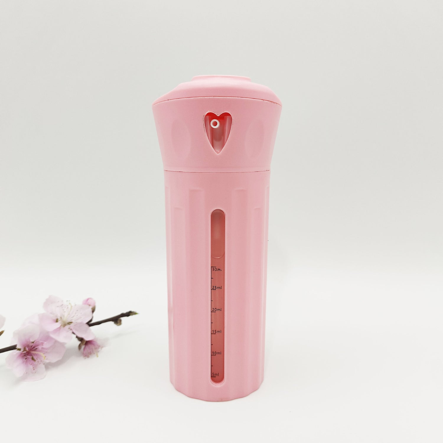 Rotating travel bottle case shown with pump and spray tops for shampoo and lotion