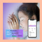 Smart ring on a sleeping woman hand beside phone sleep tracking screen