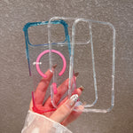 Three clear polycarbonate phone cases fanned in a hand, blue tinted, clear and pink tinted