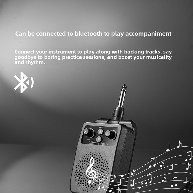 Plug in guitar amp with its quarter inch plug and swivel joint shown from the top