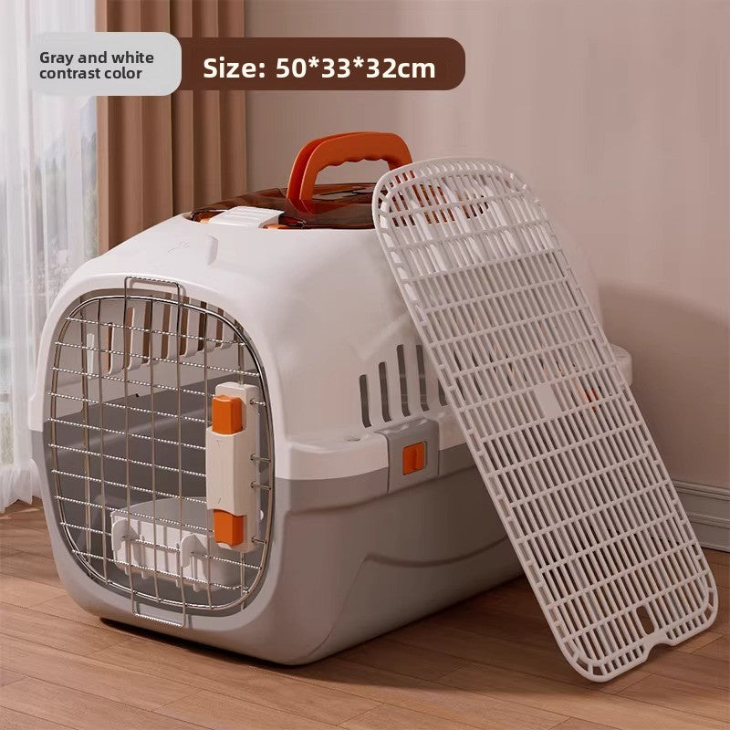 Pet travel crate carried by the top handle with the door latched shut