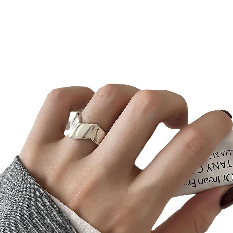 Geometric open silver-tone ring shown front on with the split adjustable band