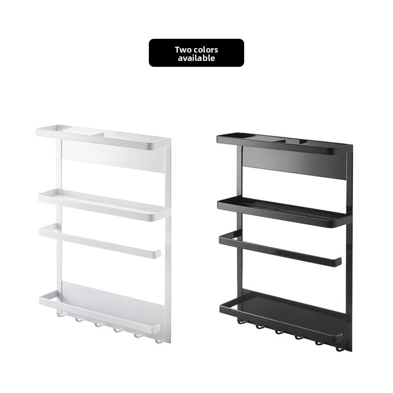 Row of hooks under the magnetic fridge rack holding stainless steel kitchen utensils