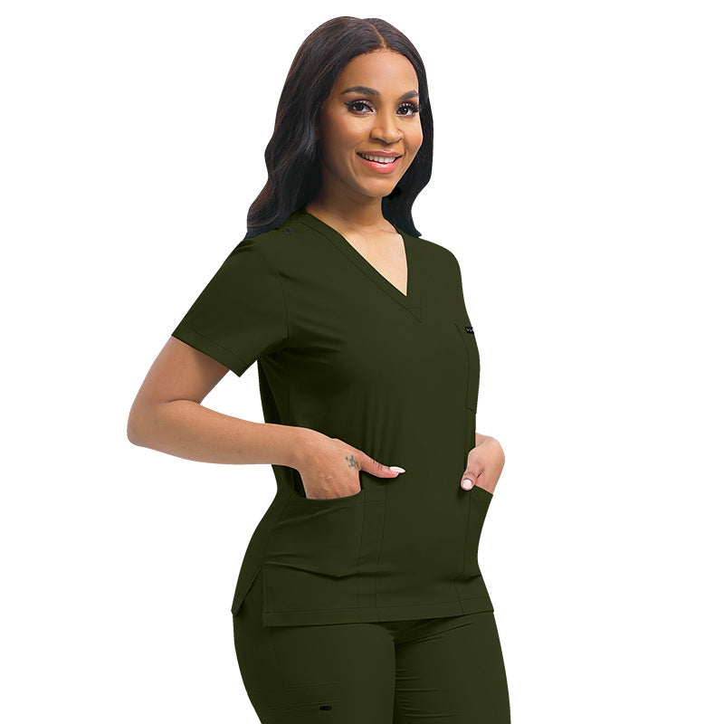 Close view of the V neck collar and chest pocket on the scrub top
