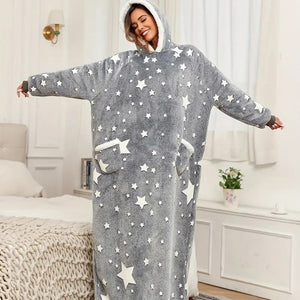 Model with arms spread showing the oversized grey star print fleece lounge robe and lined hood