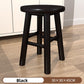 Walnut round stool with low stretcher ring viewed from a front angle