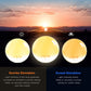 Sunrise alarm clock lamp with touch controls and an orange glowing dome on white