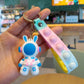 Close view of the soft PVC astronaut rabbit figure with painted blue and pink spacesuit details