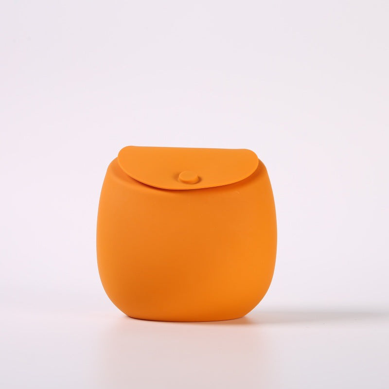 Silicone dog treat pouch shown from the front with its rounded magnetic flap
