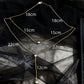 Detail of the Y junction where the lower chain meets the rhinestone drop