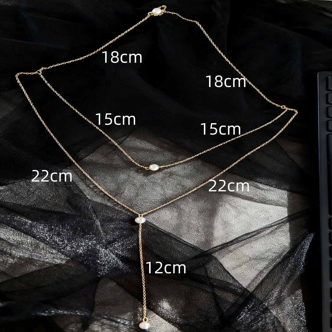 Detail of the Y junction where the lower chain meets the rhinestone drop