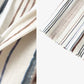 Fabric drape detail showing painterly vertical stripes on soft viscose