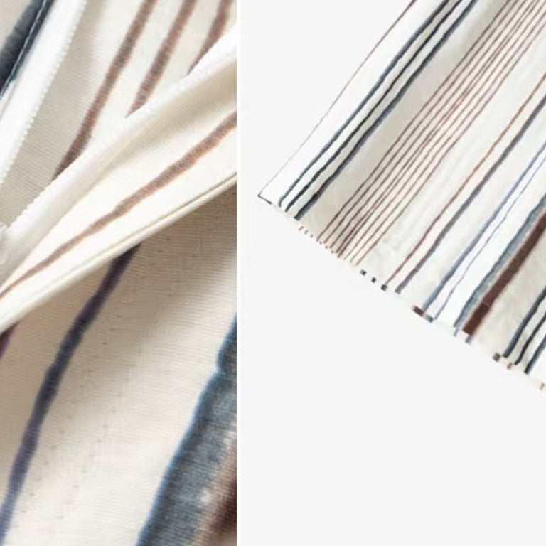 Fabric drape detail showing painterly vertical stripes on soft viscose