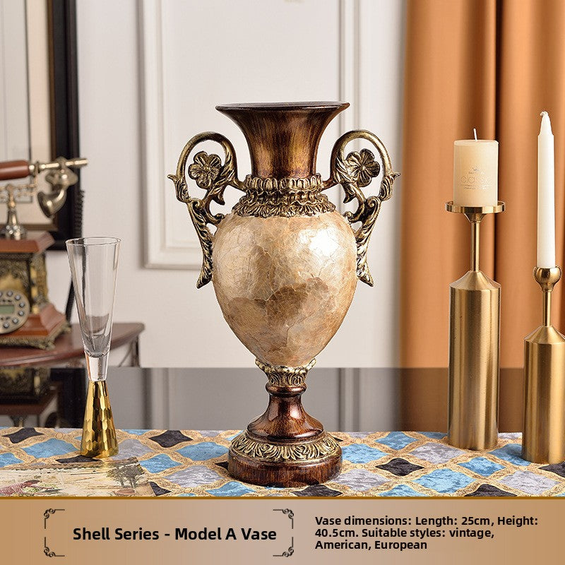 Ornate European resin decor piece with a glossy wood grain finish and antiqued gold tone scrollwork trim