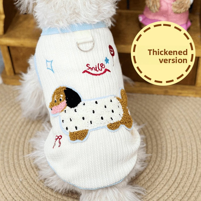 Sleeveless small dog vest with a back leash D-ring and a dachshund applique neat product shot of the dog vest