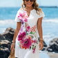 V-neck starfish and seahorse print A-line beach dress, styled with a straw bag and sandals