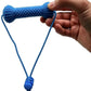 Close crop of the blue nubbed bone chew toy held in a hand, cord loop and blue cord lock hanging below