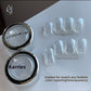 Shimmering crystal nail powder in an open jar with a silver lid on white