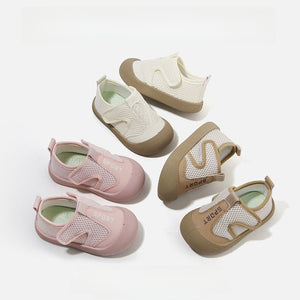 Beige toddler breathable mesh slip on sports shoe showing the soft flexible rubber sole and SPORT trim