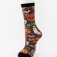 Mid-calf sock on a mannequin printed with Trick or Treat lettering, ghosts, skulls and pumpkins