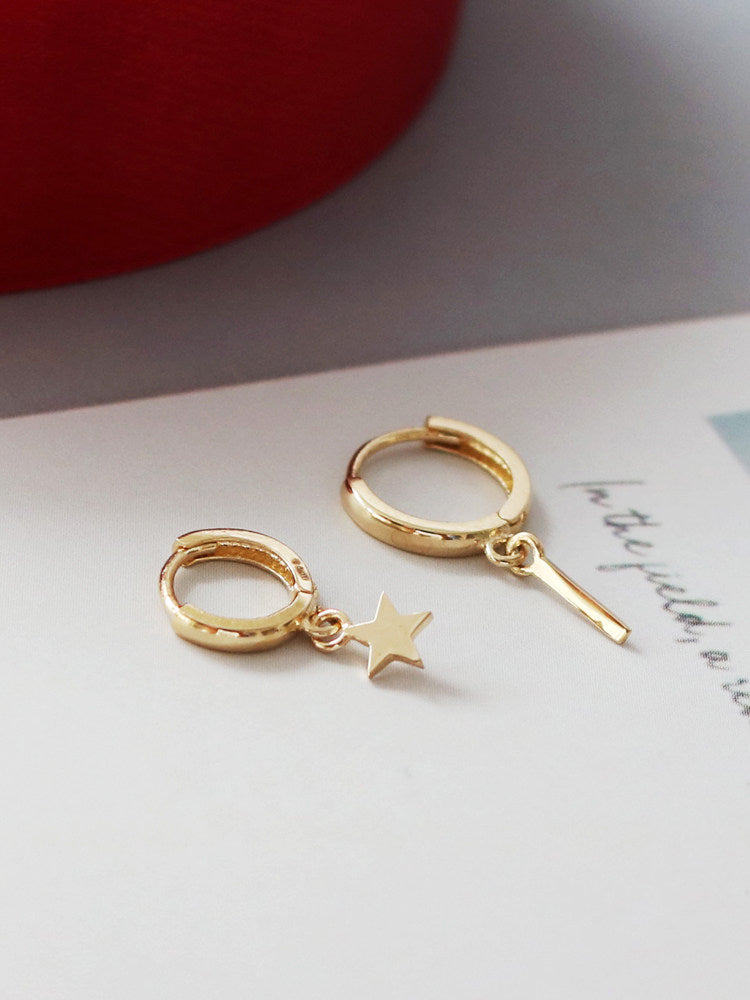 Earrings stored back in the velvet pouch with the drawstring open
