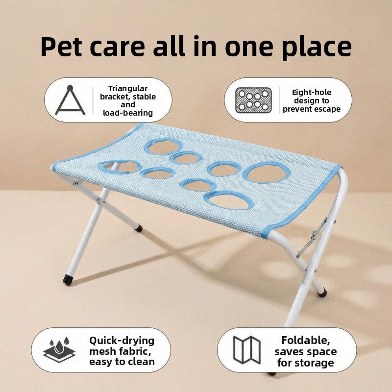 Foldable pet grooming stand, close view of the mesh holes and stainless frame