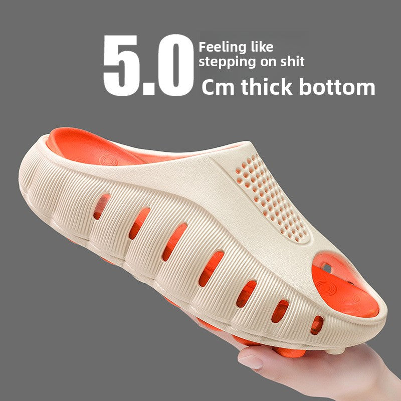 Cream and orange EVA clog with closed toe, side vents and a studded outsole