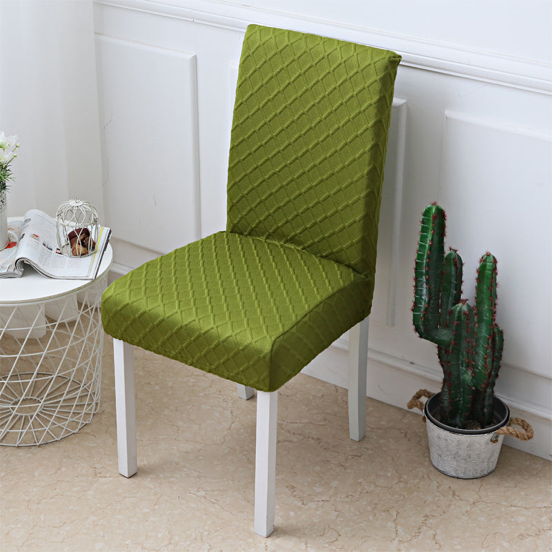 Diamond jacquard chair cover shown on a dining chair from the side