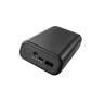 Black power bank marked 20000mAh with DC output plus USB-A and USB-C ports against a factory backdrop