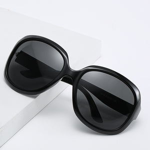 Black polarized sunglasses showing TAC lenses angled view