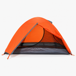 Double layer camping tent pitched outdoors with the waterproof outer fly over the frame