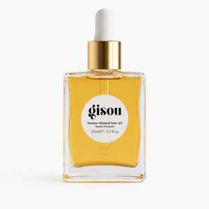 Hair nourishing oil 20ml bottle styled on a bathroom shelf beside a mirror
