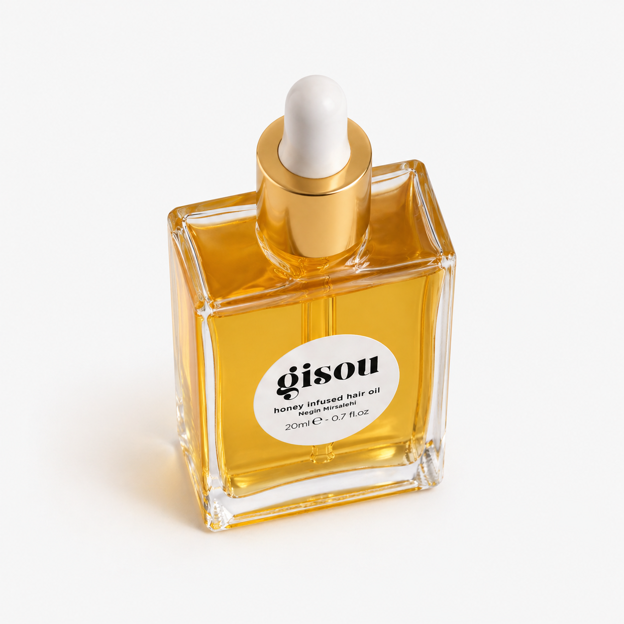 Close-up detail of the hair nourishing oil bottle cap and label