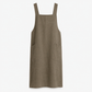 Cross back tie detail seen between the shoulder blades of the cook