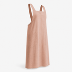 Linen apron worn by a barista pulling an espresso shot at dawn