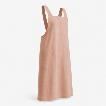 Linen apron worn by a barista pulling an espresso shot at dawn