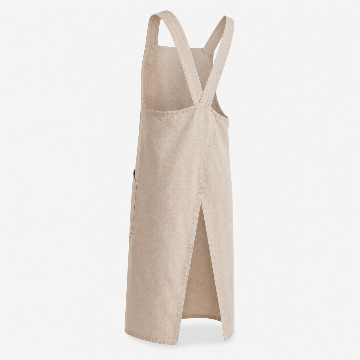 Hand sliding a notebook into the deep front pocket of the apron