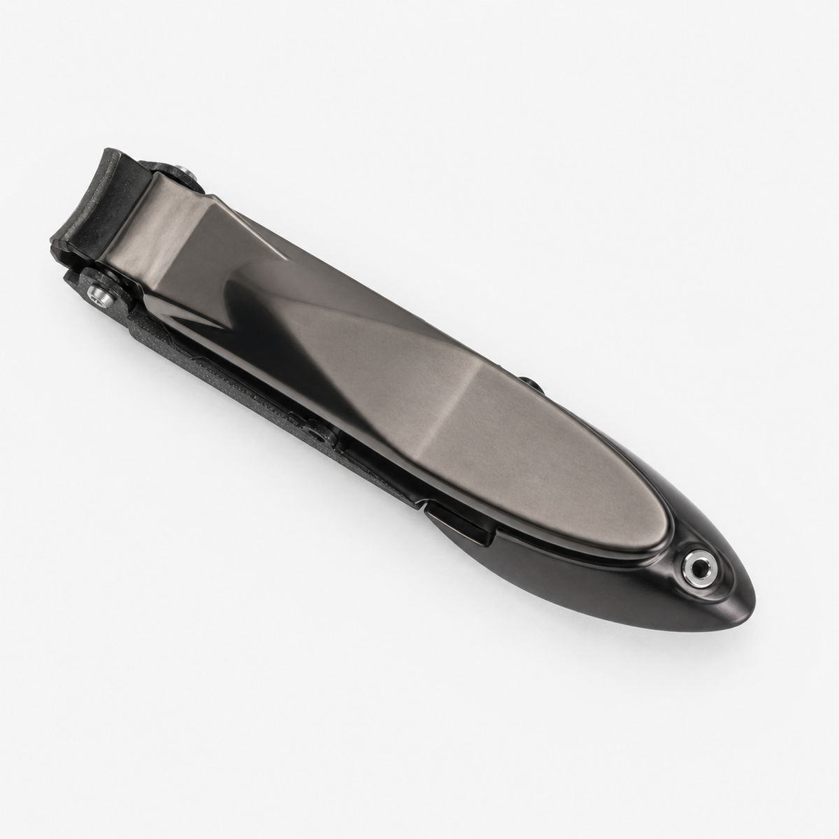 Close up of the hinged splash guard over the nail clipper cutting edge