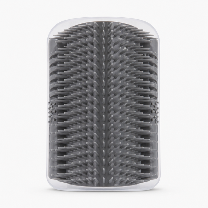 Cat self grooming brush mounted on a corner with a cat rubbing against the bristles