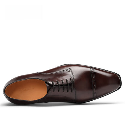 Top down view of one brown cowhide derby shoe, five eyelet open lacing and Mulieren stamped leather insole