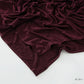 Corner of the modal cotton headscarf wrap showing the neat rolled hem and flat solid color
