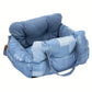 Padded car seat pet bed with raised bolster walls, carry handles and an inner clip showing the seat anchoring strap