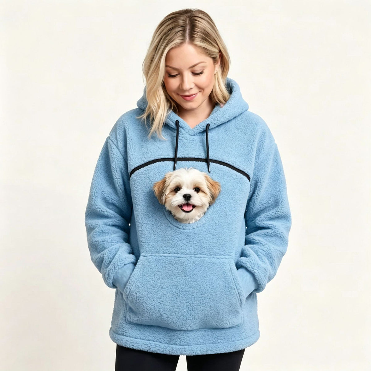 Sky blue teddy fleece hoodie with a small dog's head looking out of the chest opening above the front pocket